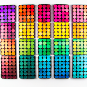 Suggestion: A selection of colorful eyeshadow palettes arranged in a rainbow pattern.