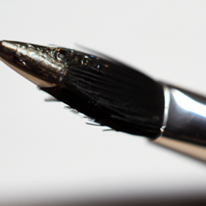 A closeup of a black and silver winged eyeliner brush.